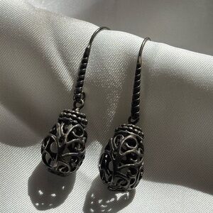 Dark silver tone dangling “cage” earrings.